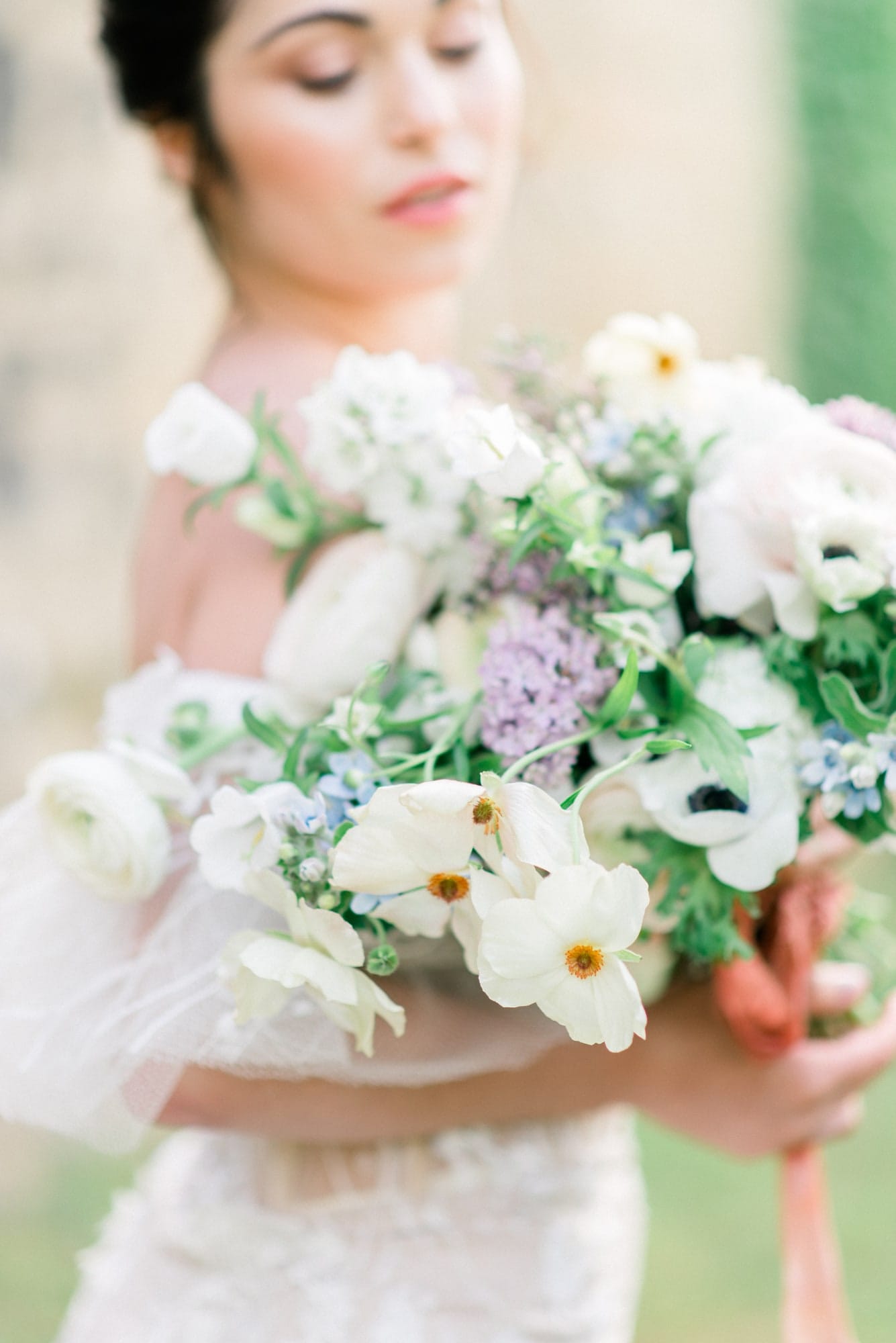 bride-bouquet-elegant- Bride with a beautiful bouquet of fresh flowers