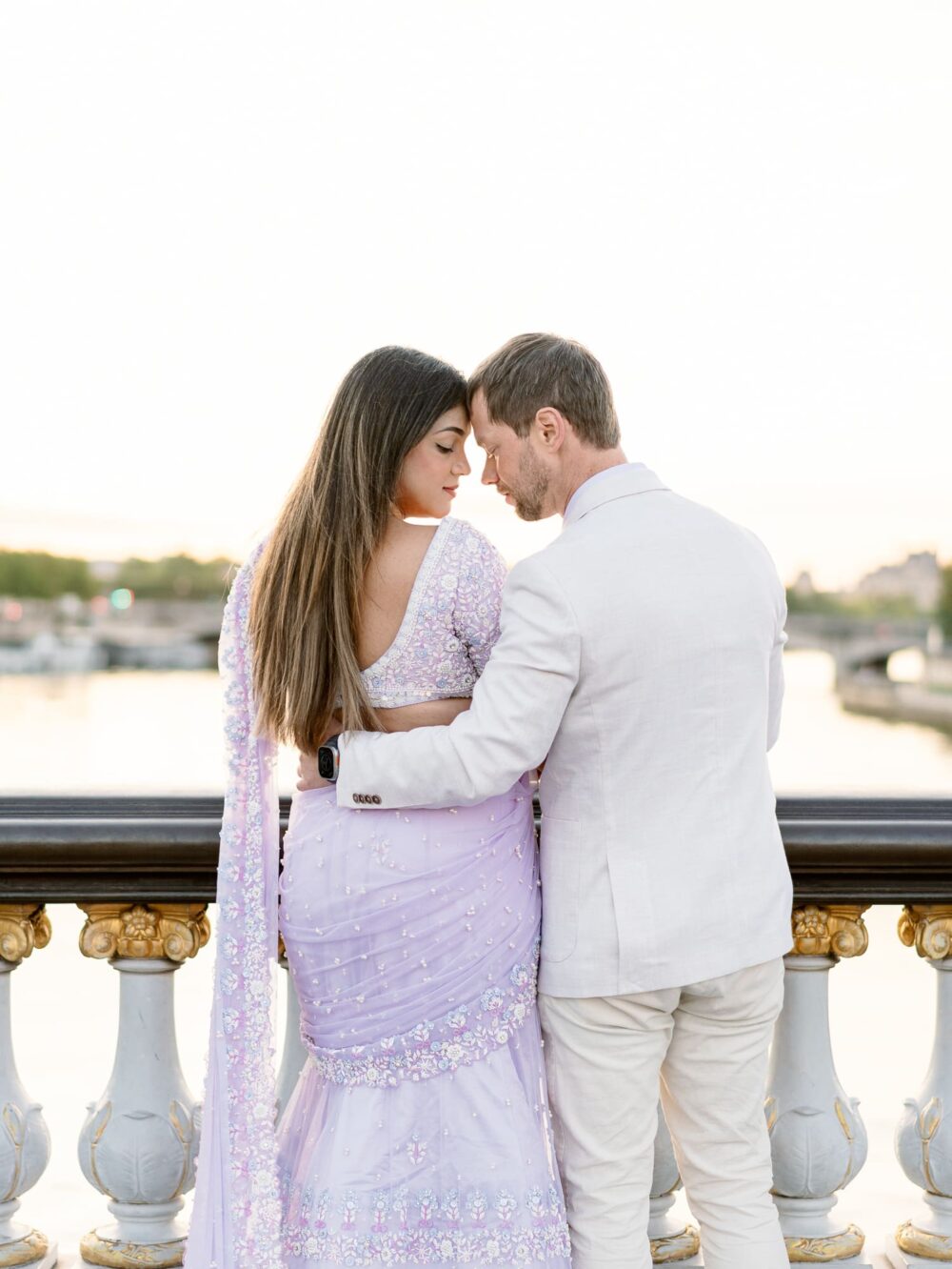 Romantic photo of the couple forehead to forehead