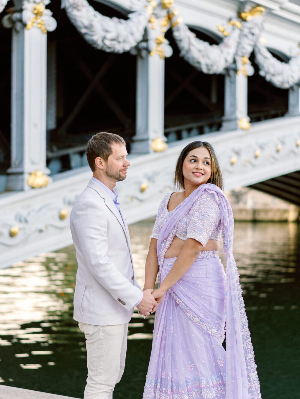 couple below Pont alexandre III, by the water