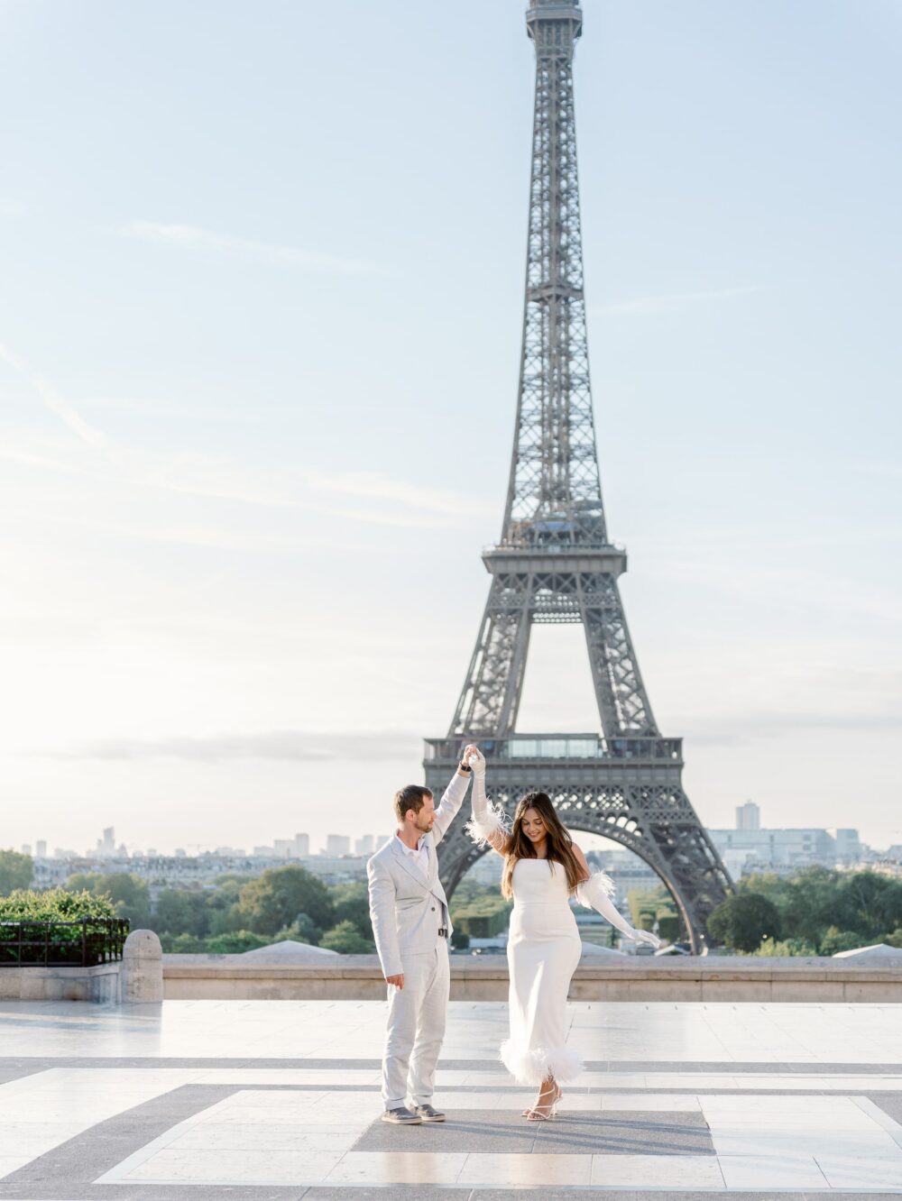 couple dancing in front of the Eiffel tower