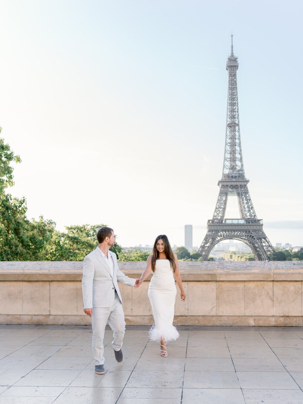 couple holding hands and walking