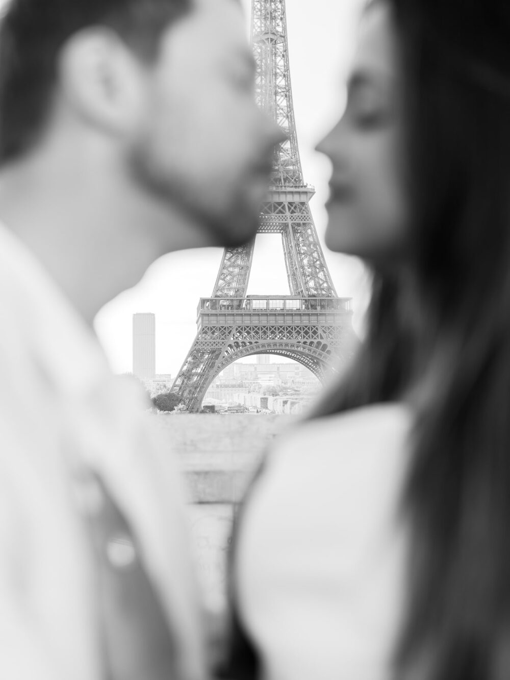 view of the Eiffel tower between the couple