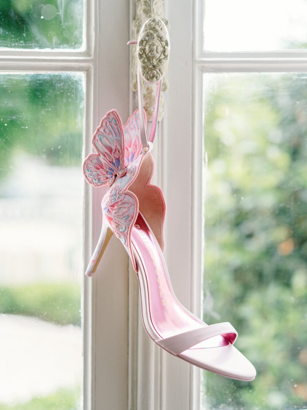 Pink wedding shoes with butterflies