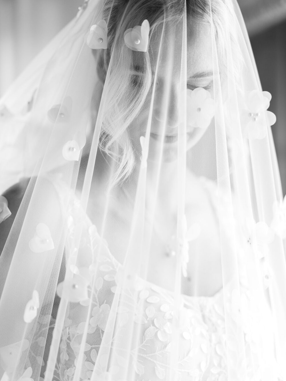 Close up portrait of the Bride and her veil covered with flowers
