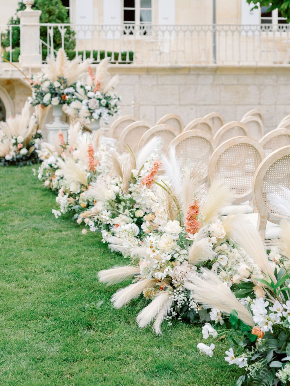 wedding ceremony alley with pampa flowers, white roses and touches of peach