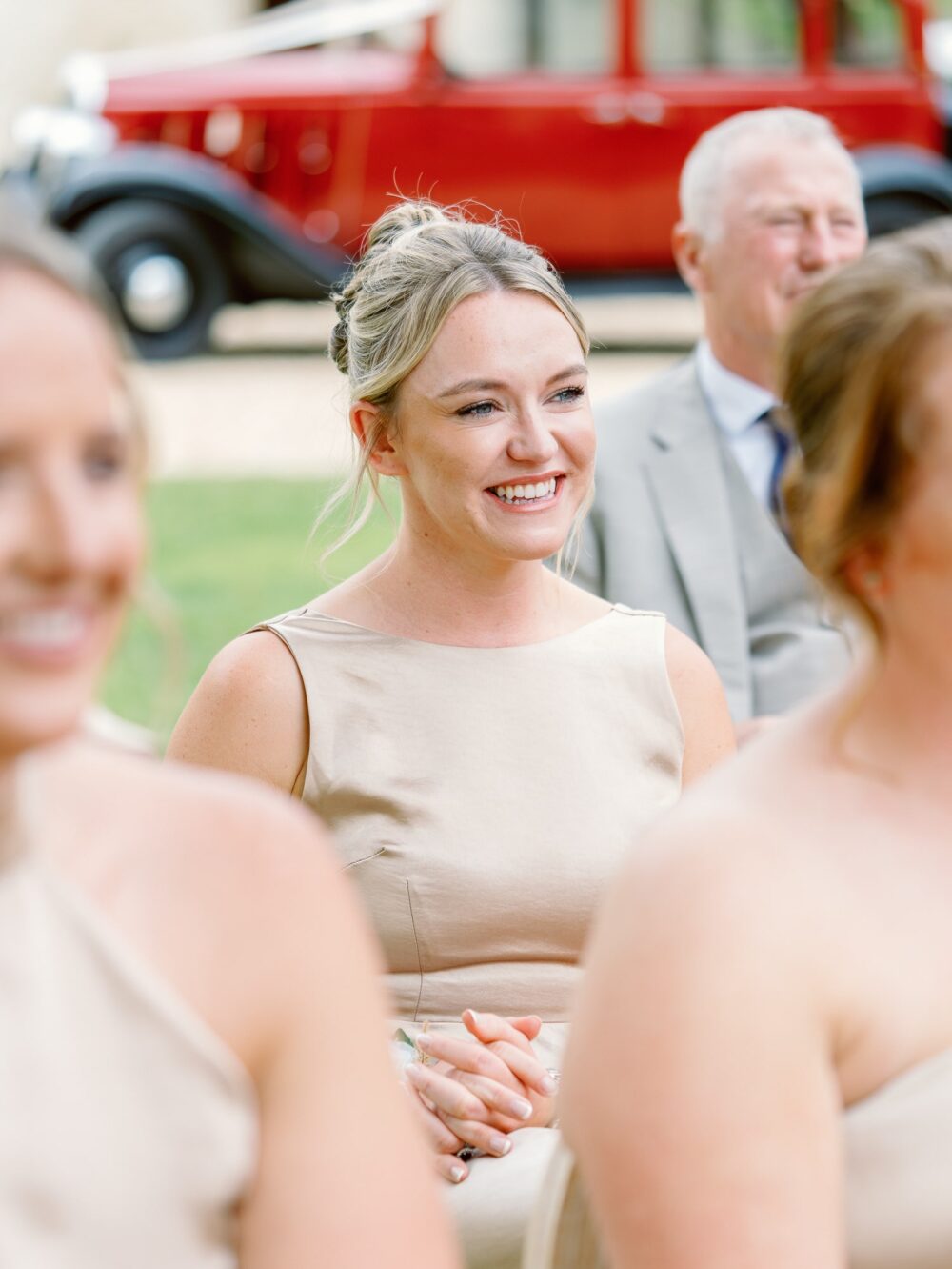 A bridesmaid among the guests