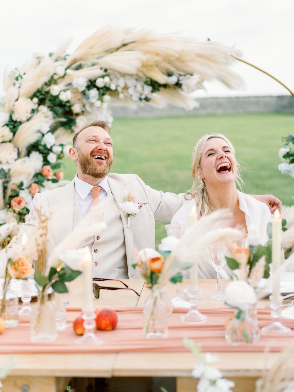 bride and groom laughing