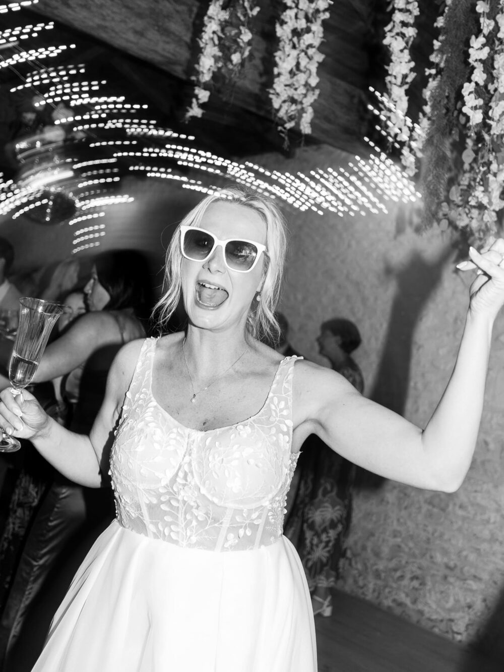 bride on the dance floor wearing sunglasses