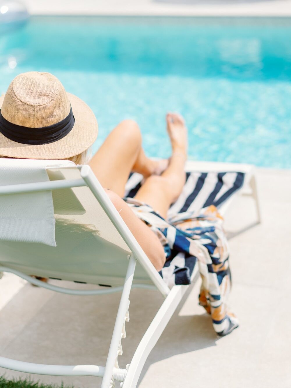 guest sunbathing on a deck chair