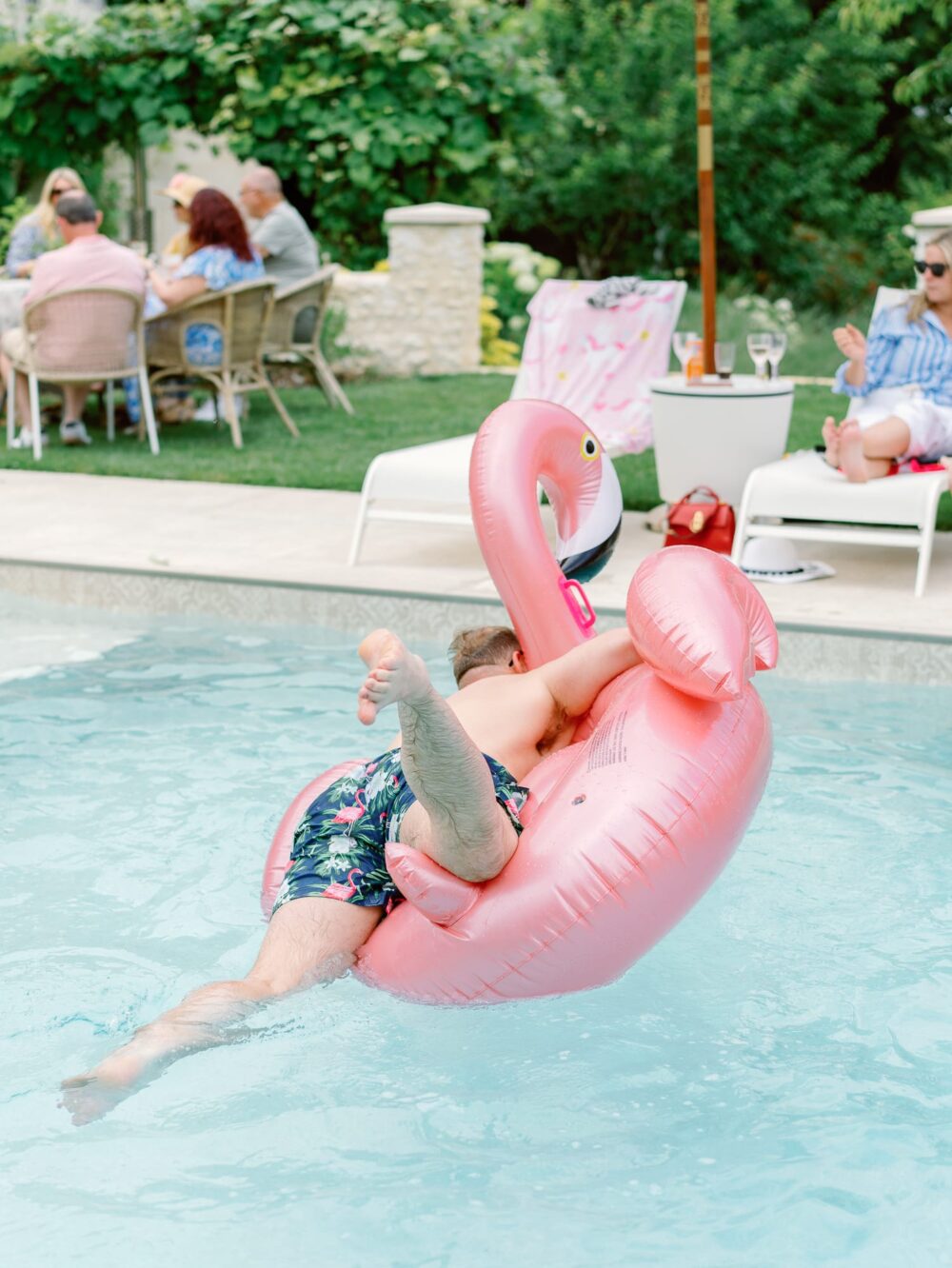 groom trying to climb onto the flamingo