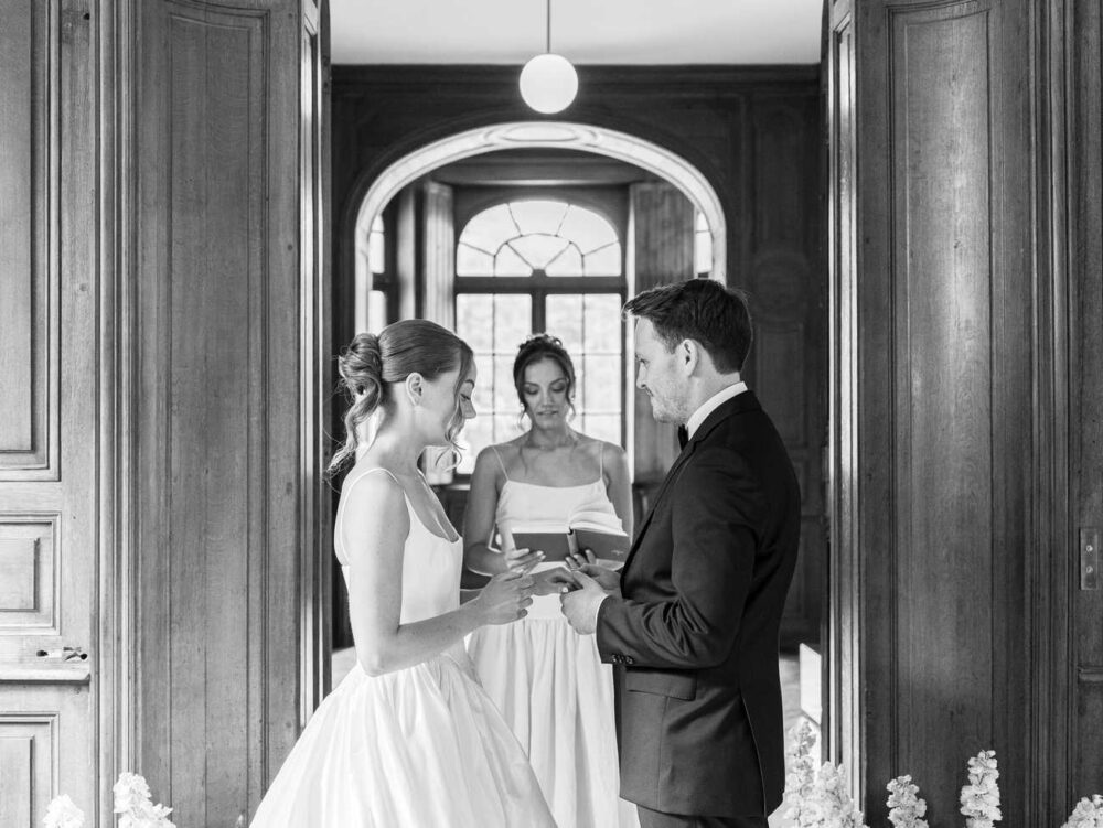 Bride and groom exchanging rings