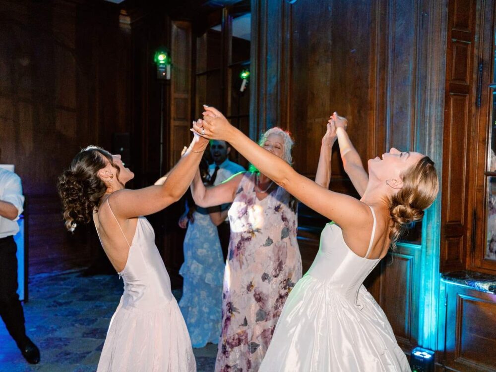bride dancing with her mother and sister