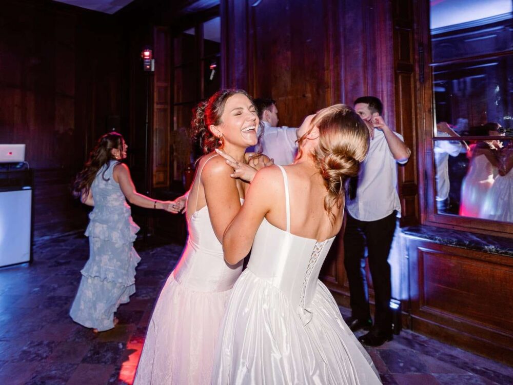 bride and her sister laughing