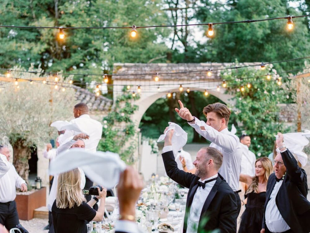 guests waving napkins