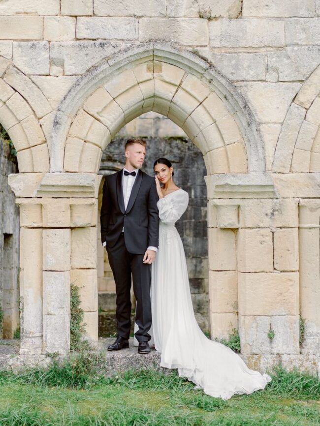 bride and groom in an old abbey