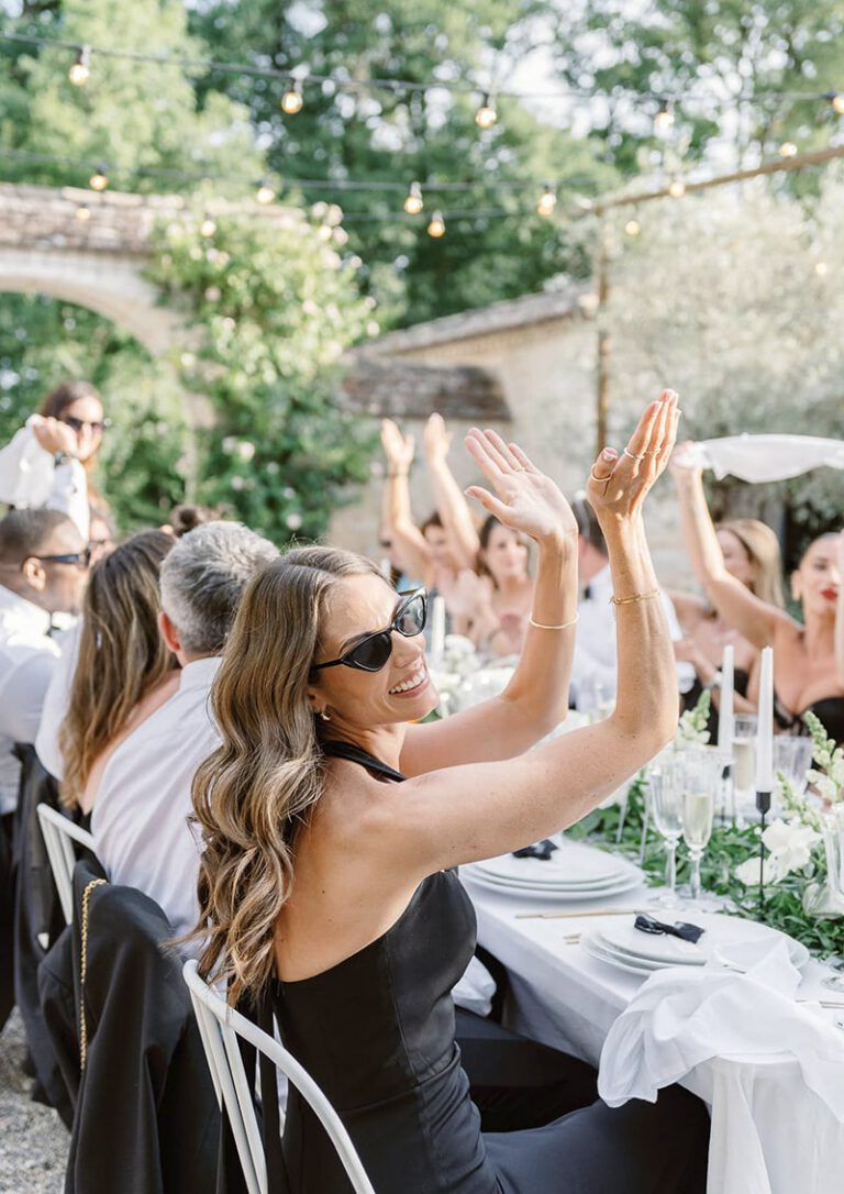 Guest applauding during wedding diner