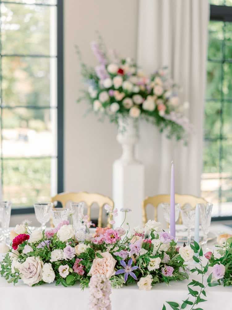 wedding reception with pink and purple flowers