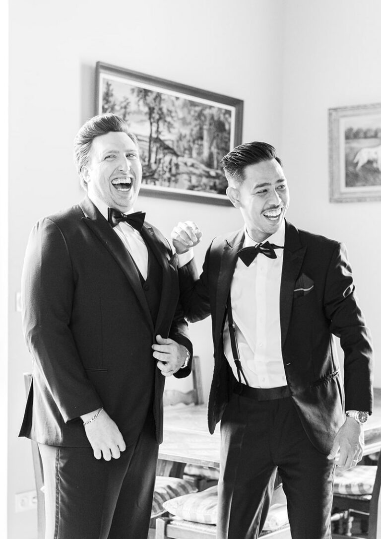 groom laughing with a friend