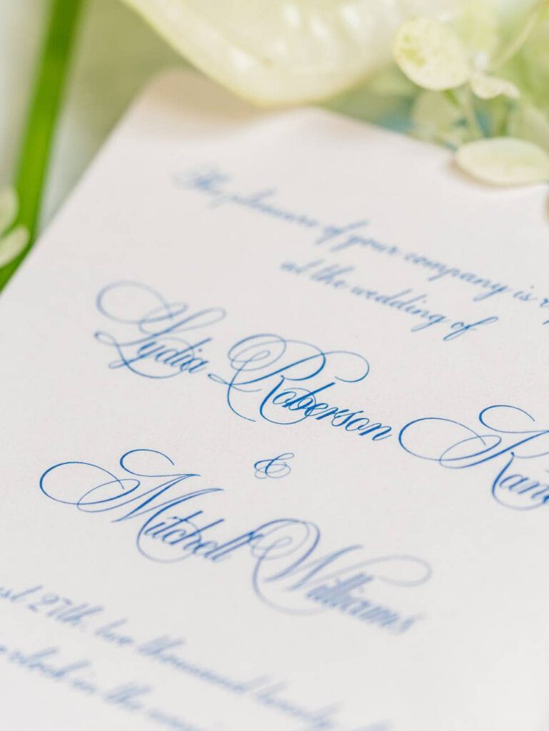 wedding invitation with blue script font