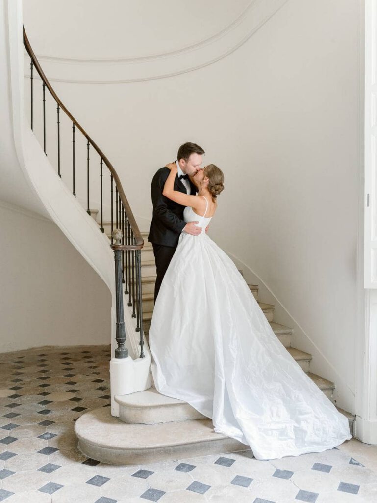 Bride and groom portrait in the staircase of Château de Thauvenay