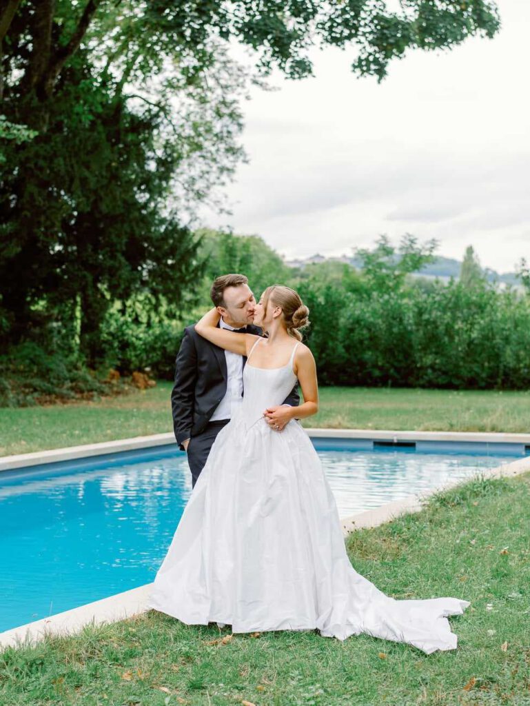 Couple portrait in front of the swimming pool