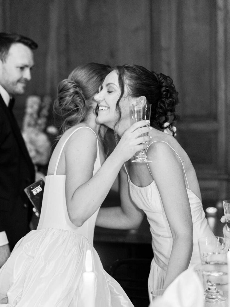 the bride and her sister hugging