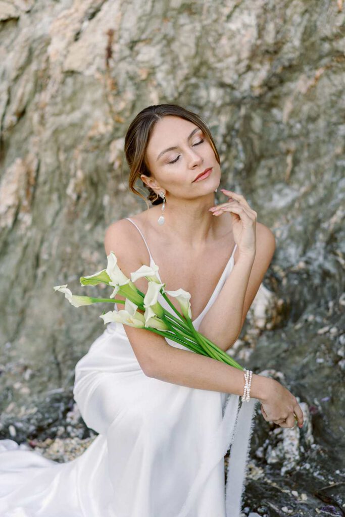bride with a bouquet of arums
