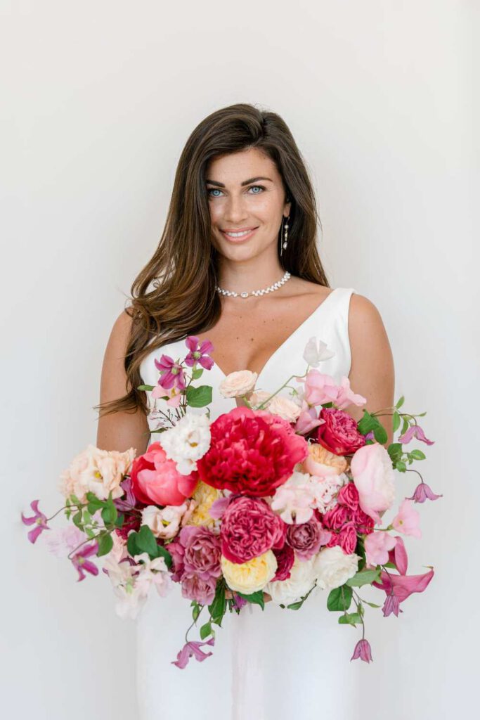 Bride with a bouquet in magenta and pink