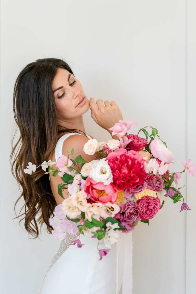 Bride with a bouquet in magenta and pink