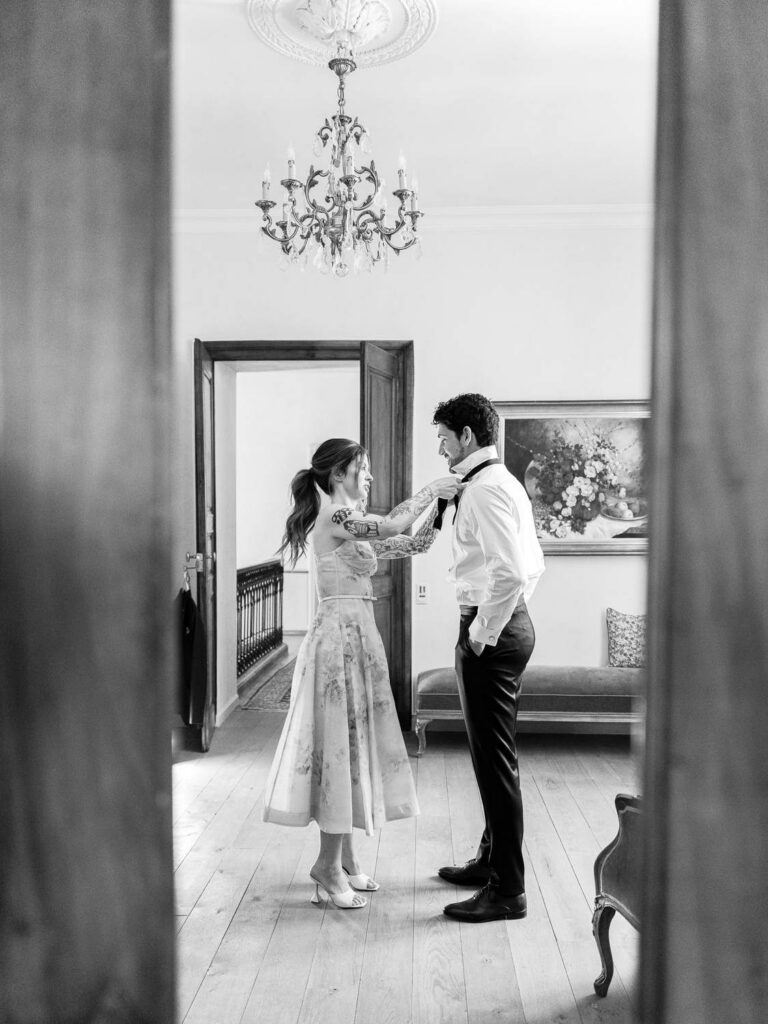 Groom getting dressed with his sister