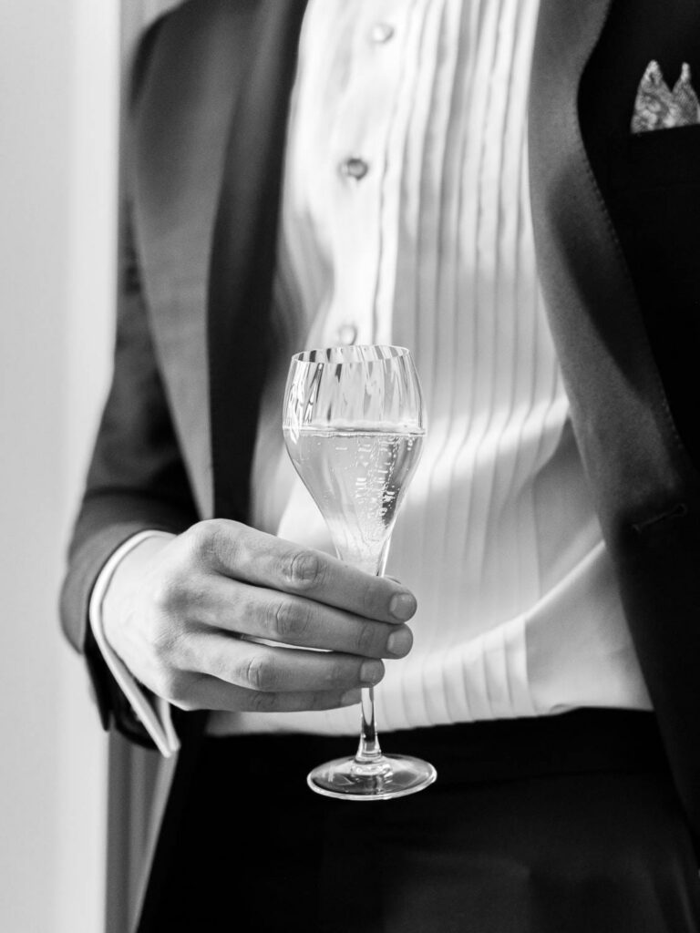 groom with a glass of champagne