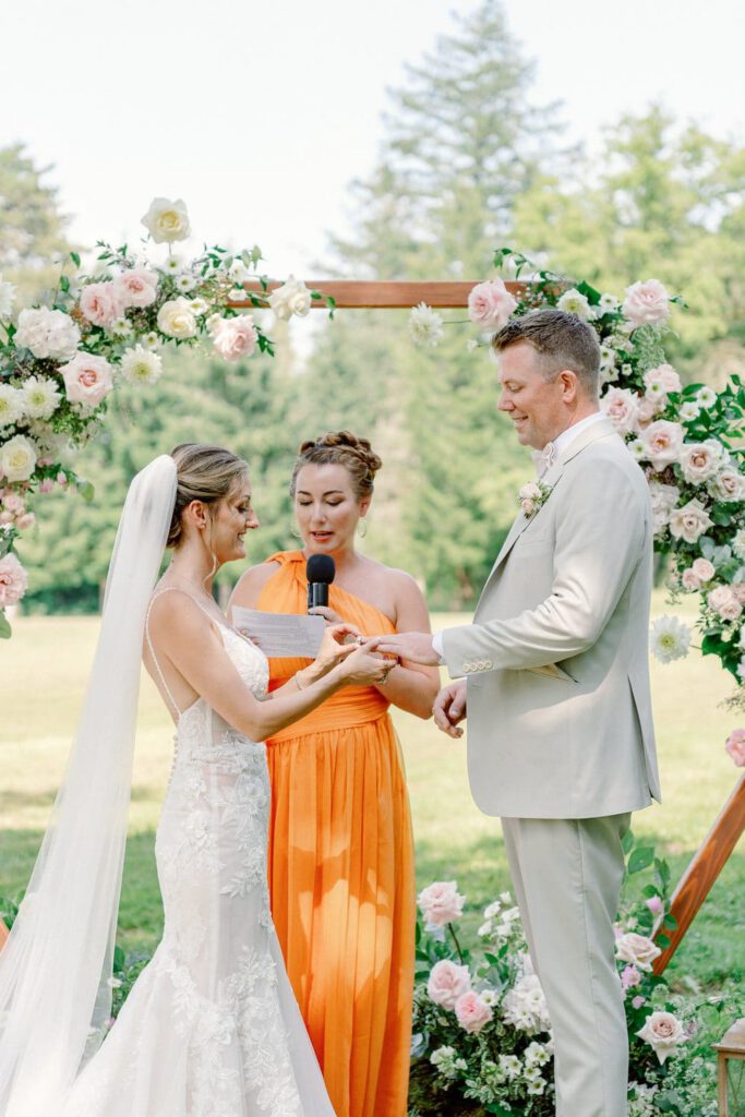 bride and groom exchanging rings