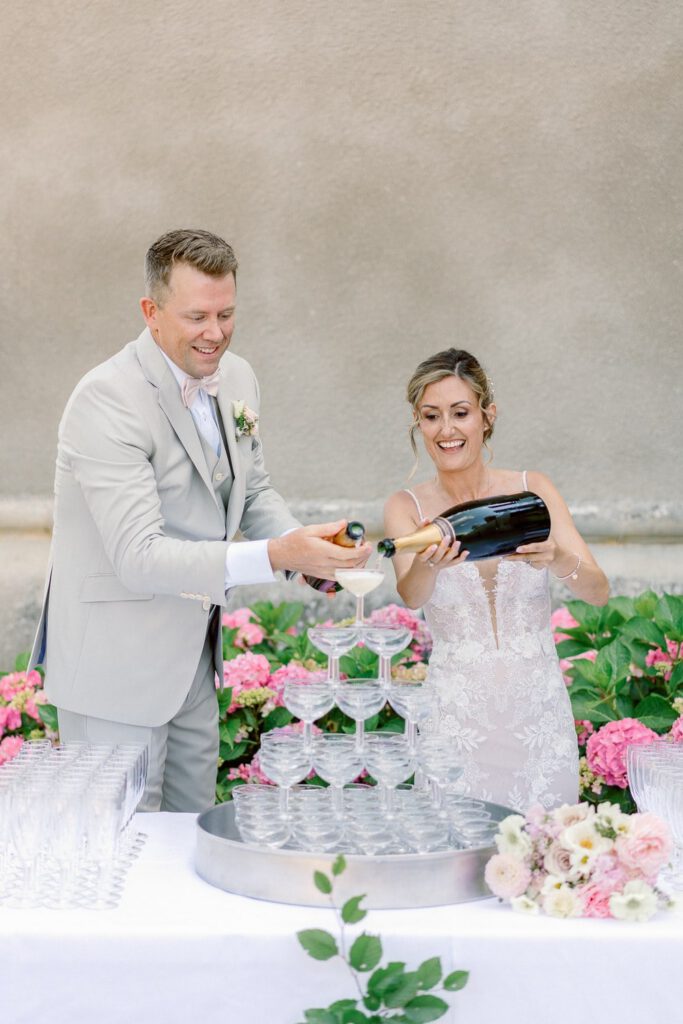 bride and groom at the champagne tower