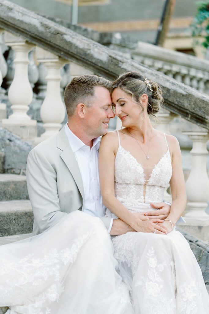 bride and groom on the staircase of the chateau