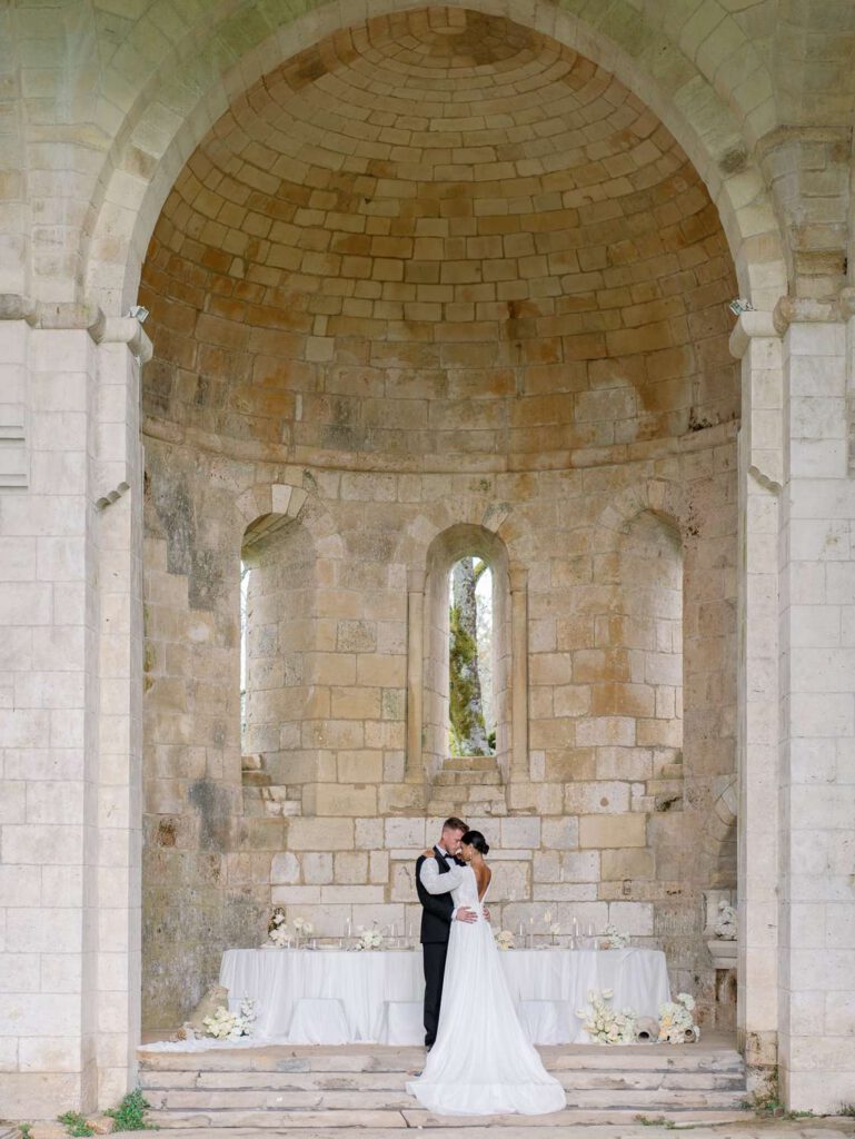Bride and groom portrait in an old abbey