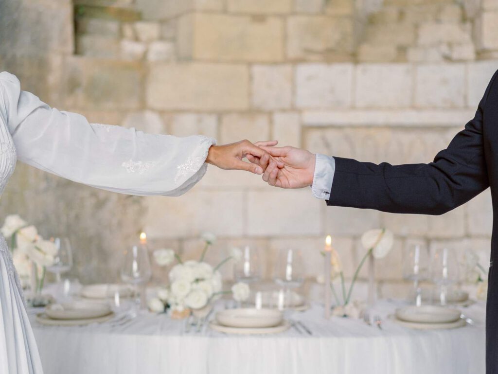 Bride and groom holding hands