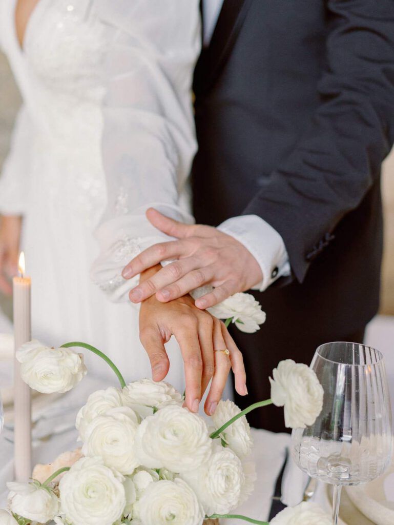 Bride and groom holding hands