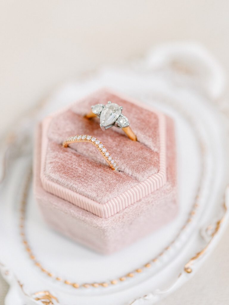 golden wedding rings in a pink box