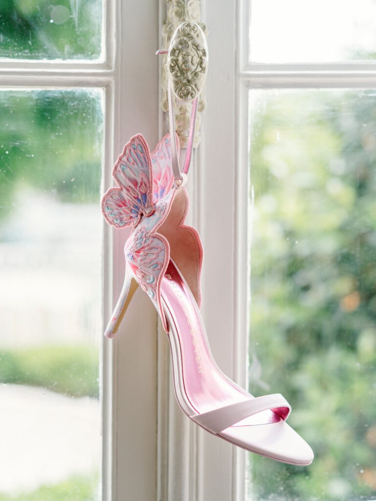 pink wedding shoe with a butterfly