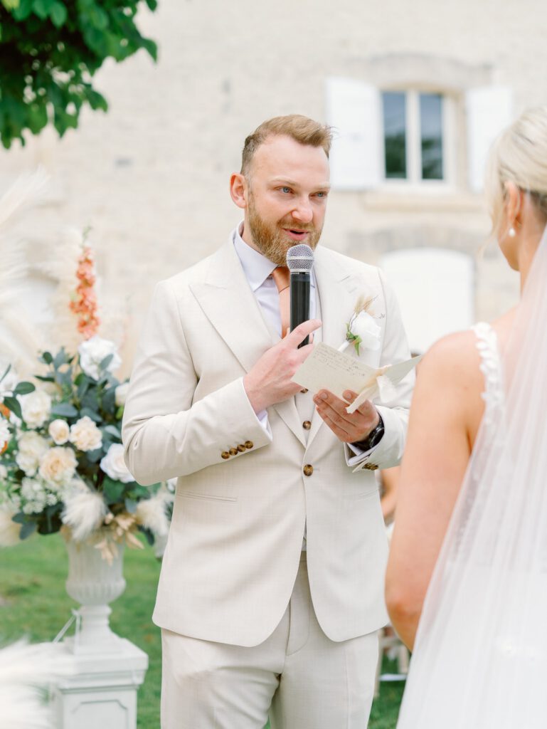 Groom reading his vows