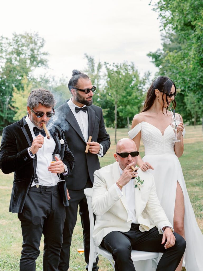 group photo with cigars and cocktails