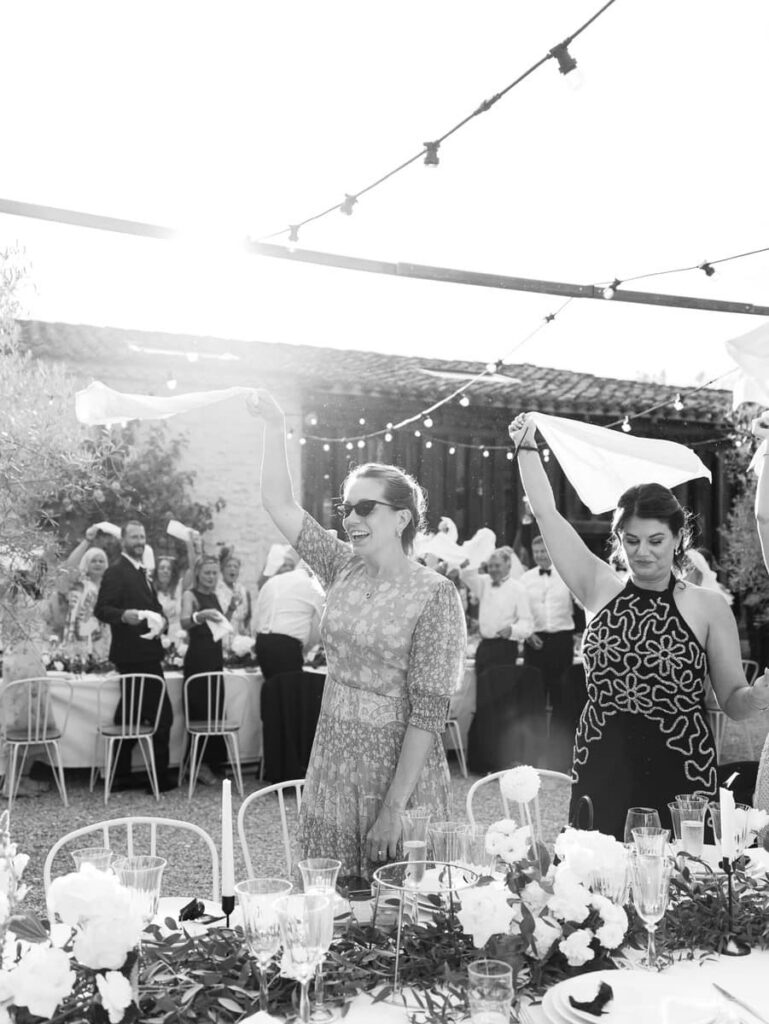 guests waving napkins