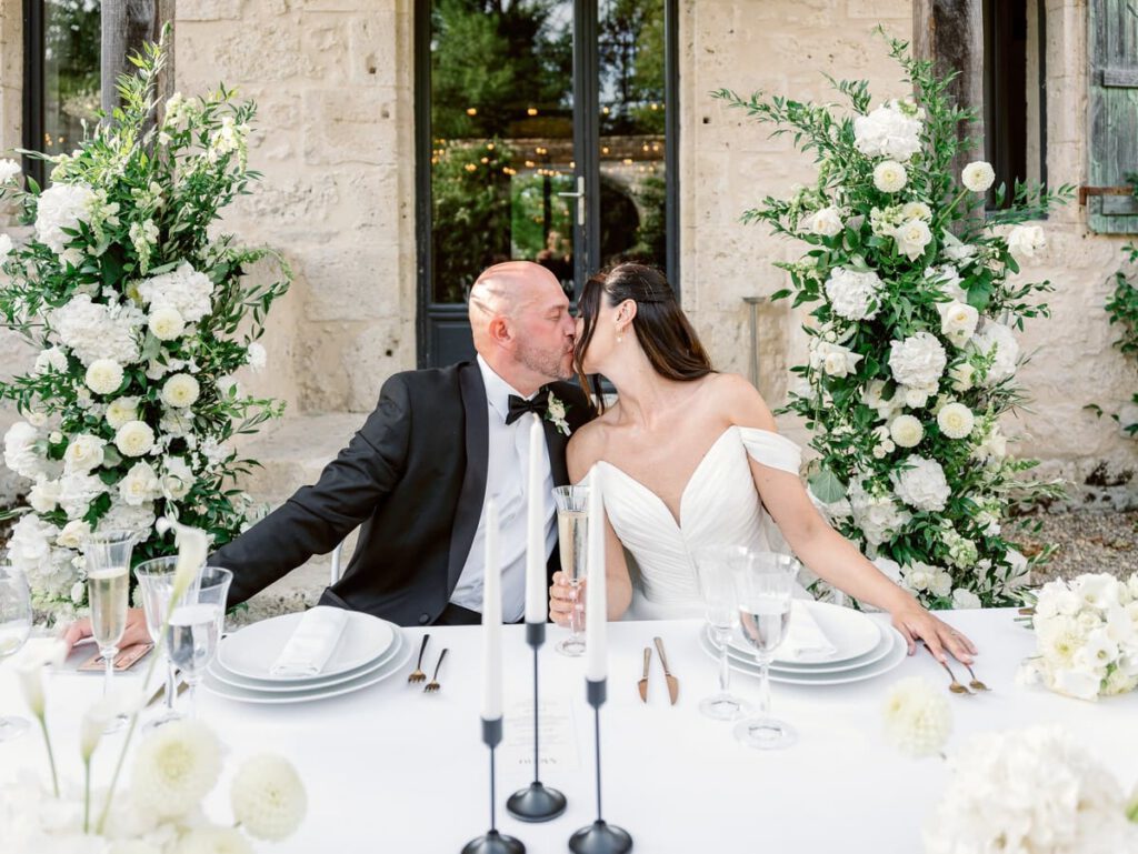 bride and groom kiss