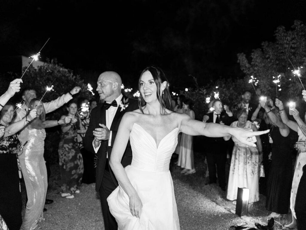 Bride walking between sparklers