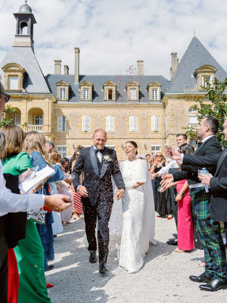 Bride and groom exit during their wedding ceremony at Domaine d'Essendieras
