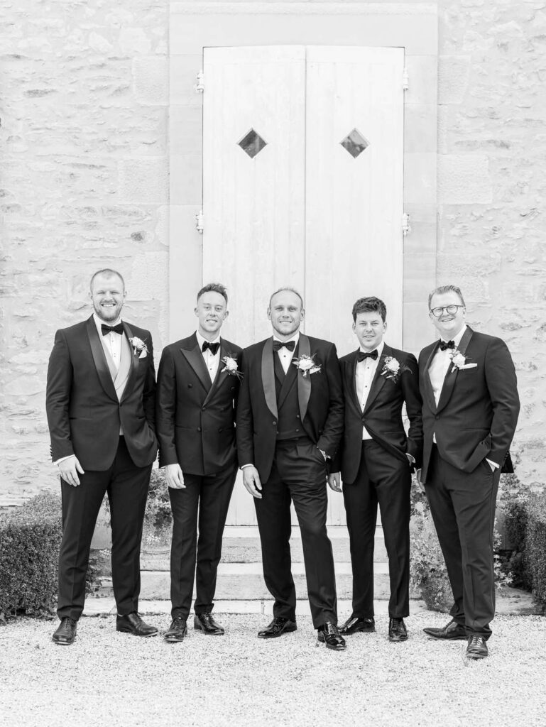 Groom and his groomsmen in black and white
