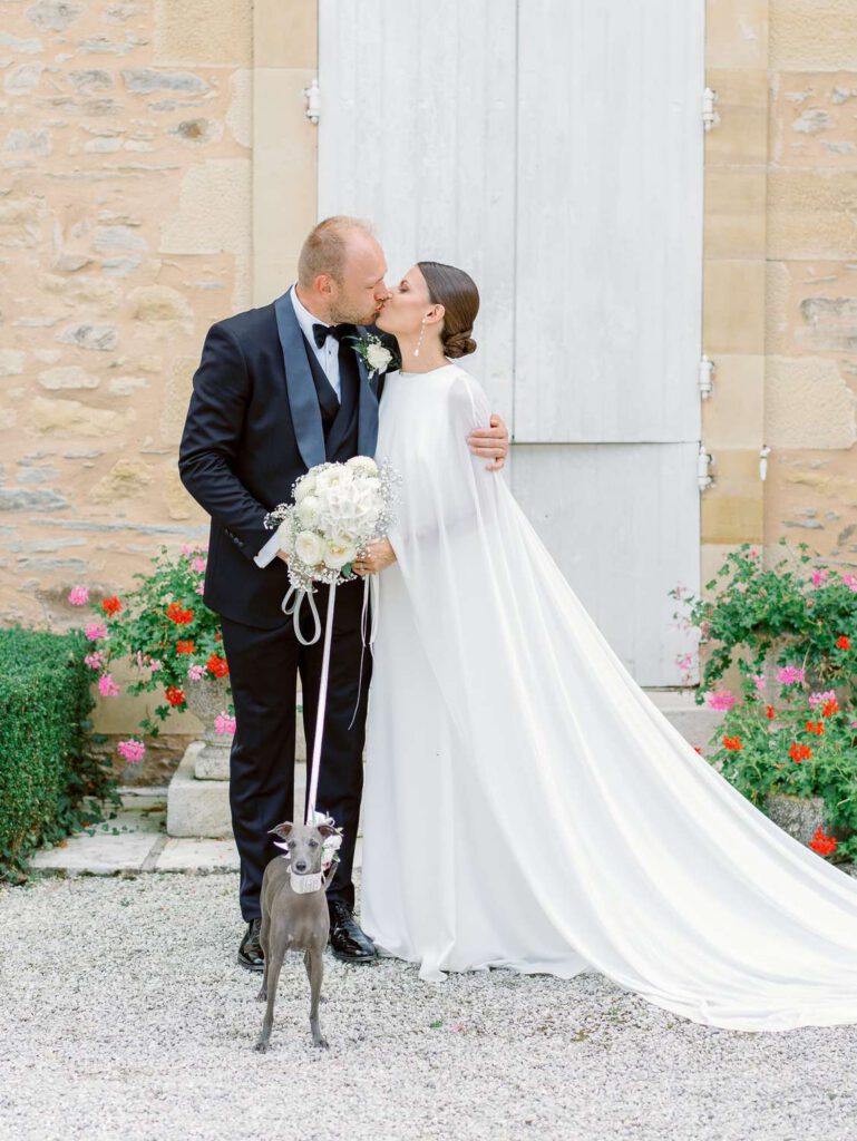 Bride and groom portrait with their dog at Domaine d'Essendieras