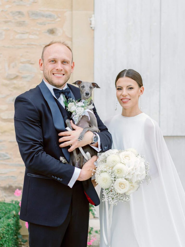 Bride and groom portrait with their dog at Domaine d'Essendieras
