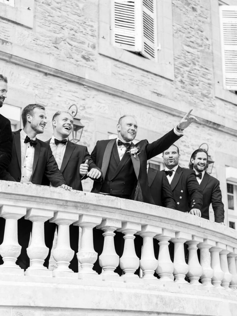 Groom and his groomsmen in black and white