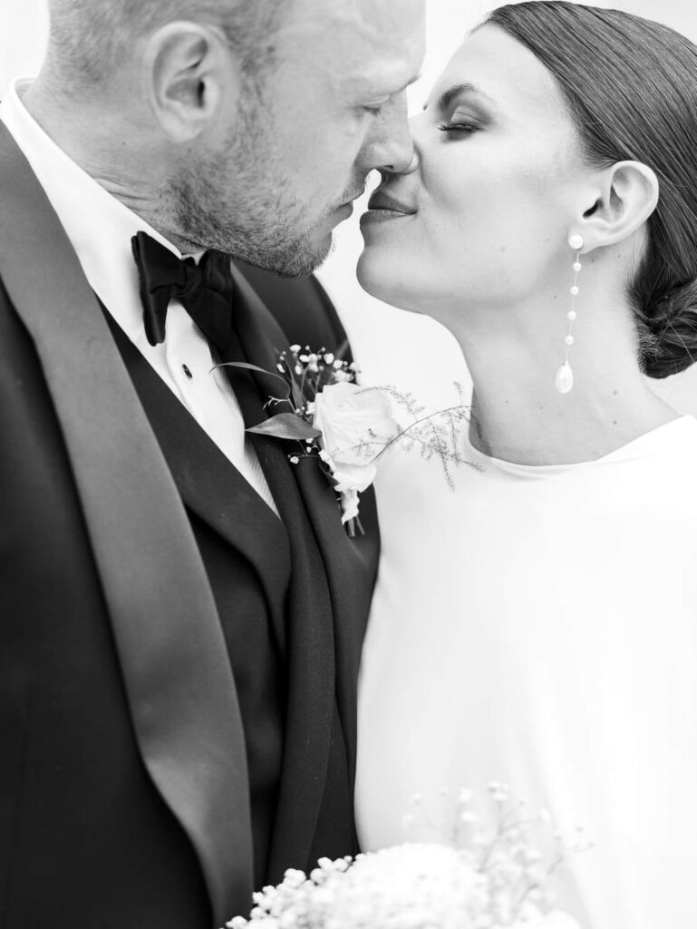 Bride and groom kiss